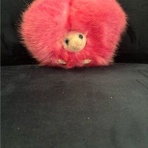 pink Pygmy Puff plush toy from the Harry Potter franchise.